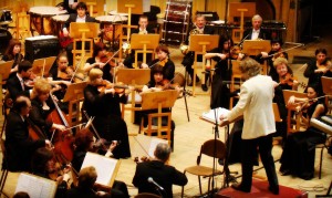 Image of condocutor and orchestra - the power over subordinates